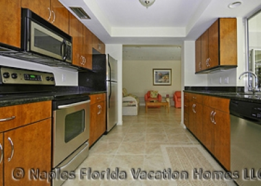 Naples Florida Vacation Homes | Monte Carlo Home: Kitchen to Family Room / Den