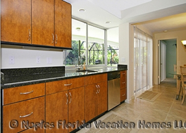 Naples Florida Vacation Homes | Monte Carlo Home: Kitchen to Pool